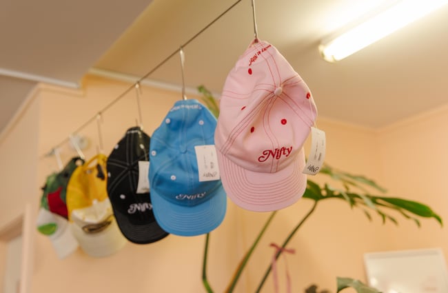 Colourful caps hanging up at Nifty.
