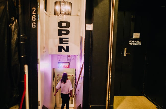 A customer walks down the steps into the venue.