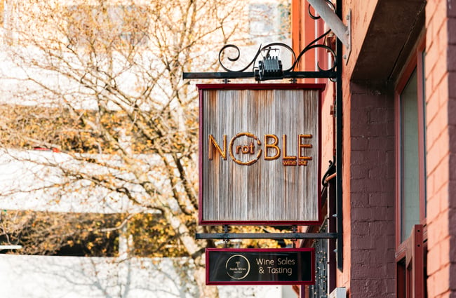 A close up of a 'Noble Rot' sign.