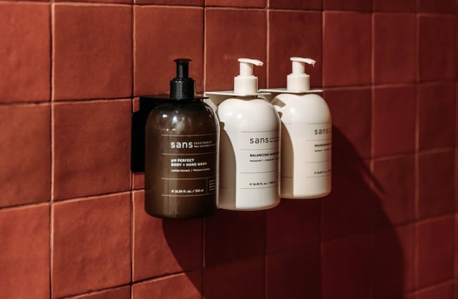 A close up of shampoos and body wash.