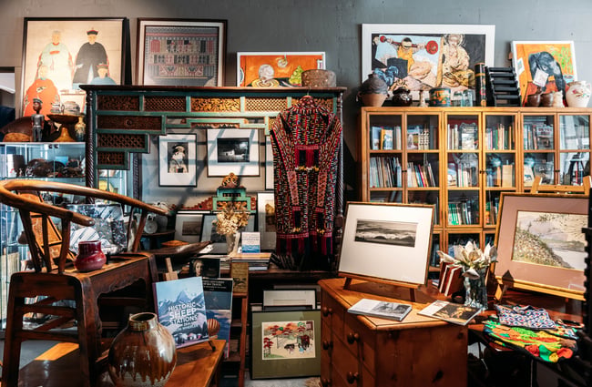 Room filled with art and furniture inspired by places all over the world