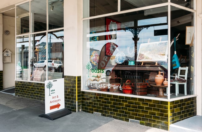 Exterior of Oásis in Ōamaru with olive green tiles