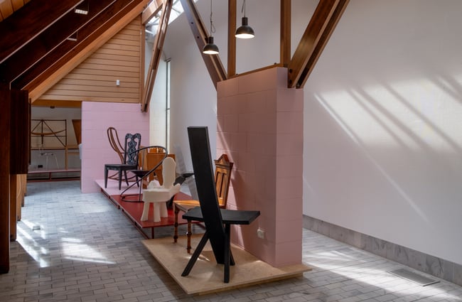 A view of chairs on display in an exhibition.