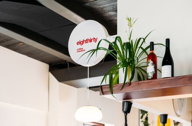 A close up of a white sign that says 'eightthirty'.