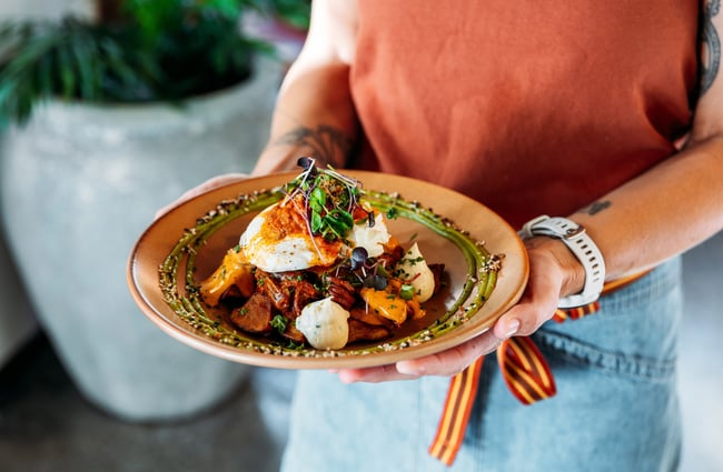 A close up of a plate of a brunch meal on a plate.