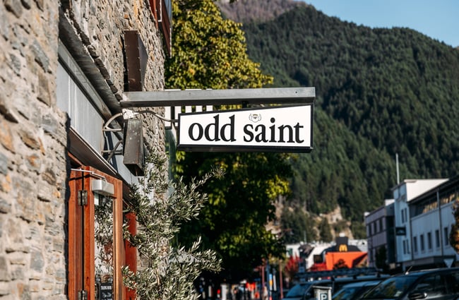 A sign that says 'Odd Saint'.