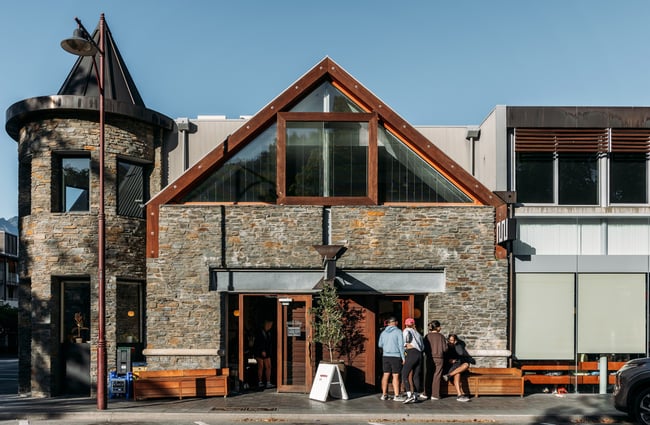 An old brick building on a sunny day in Queenstown.
