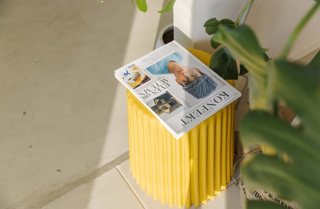 Magazine on a stool at Odds Coffee.