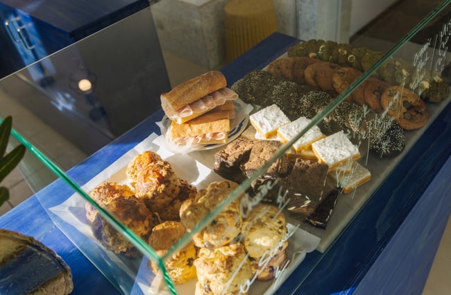 Sandwiches and cookies in the cabinet at Odds Coffee.