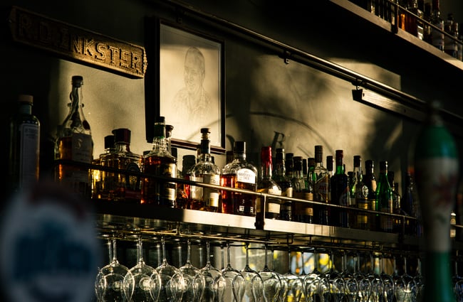 Close up of spirits on the shelf at OGB with sunlight shining on to them