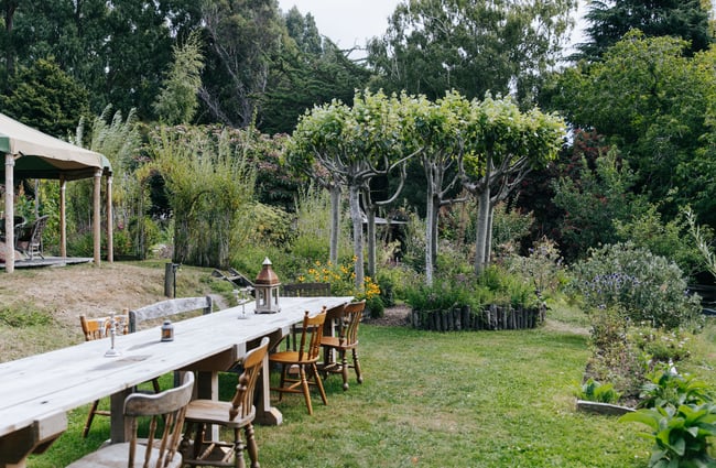 A long table outside at Okuti Garden in Little River.
