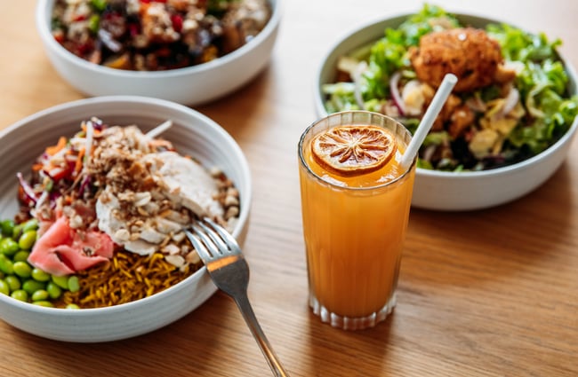 Food dishes and a drink on the table at Old Courthouse Eatery.