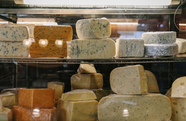 Cheeses on display in fridge at Old Factory Corner, Nelson Tasman.