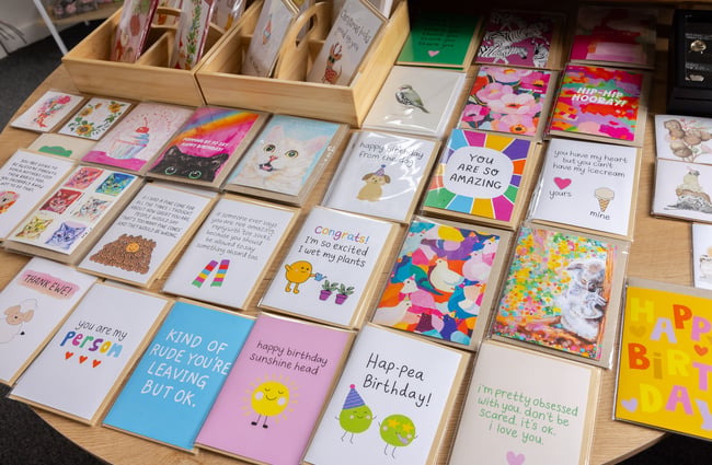 Collection of cards on a table at the Old School Collective in North Canterbury.