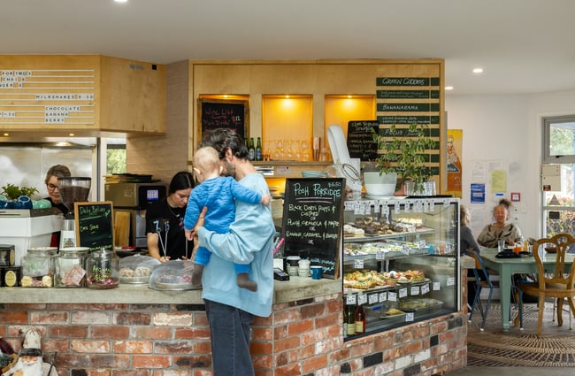 Customer ordering at the counter at the cafe at the Old School Collective in North Canterbury.