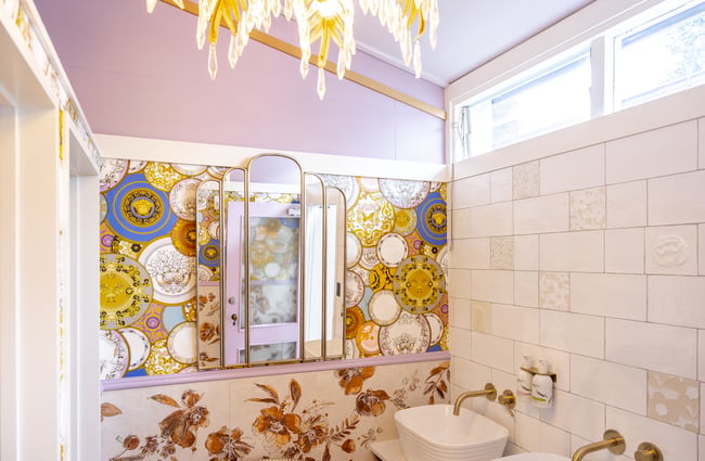 Patterned wallpaper in the womens bathroom at Old School Collective.