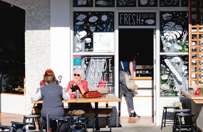 Customers sitting outside Olde Beach Bakery.