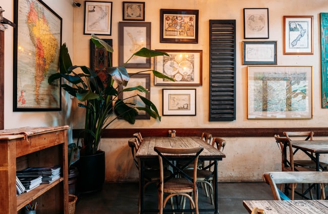 Framed art on a wall in a restaurant.