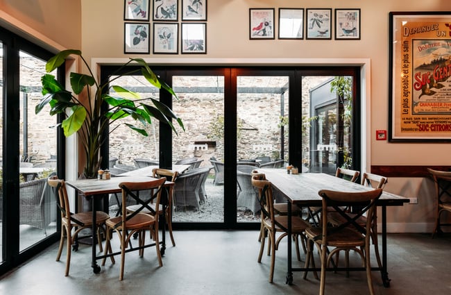Tables and chairs inside Olivers restaurant.