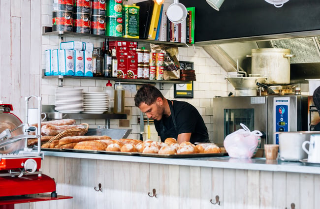 A man working behind the bar.