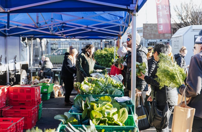 People walking around the market.