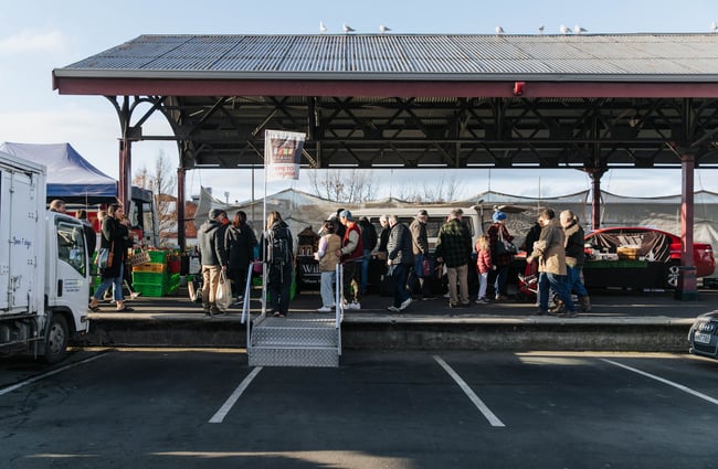 People walking around the market.