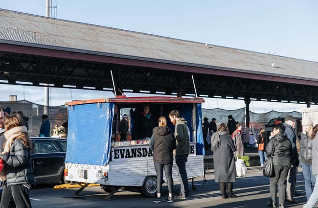 People walking around the market.