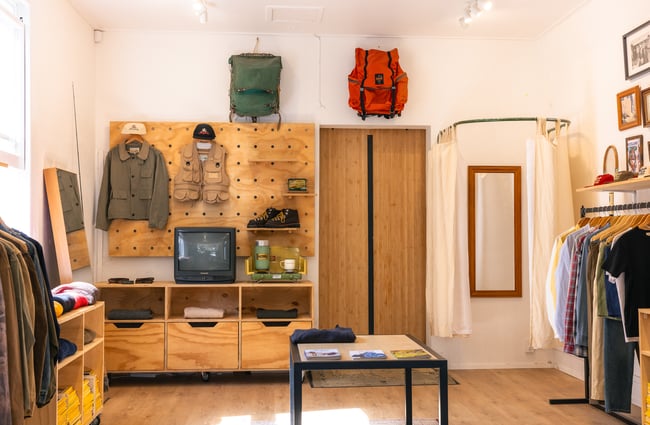 Selection of products on back wall at Outdoors Society in Auckland