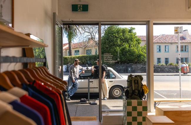Looking through door onto street from Outdoors Society in Auckland