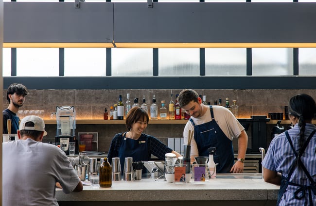 Baristas behind the counter at Ozone Coffee.