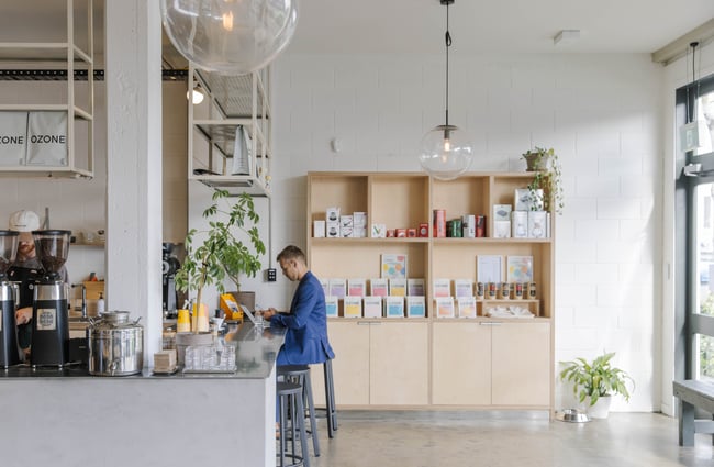 Person sitting at the counter at Ozone Coffee Walker Street.