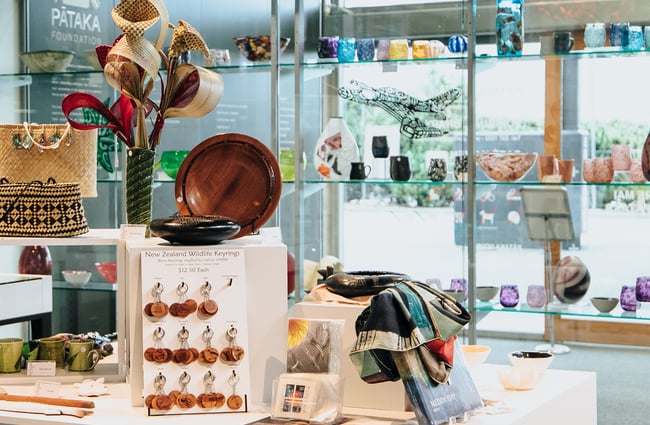 Jewellery, homewares, books and more on display in the gallery shop at Pātaka.