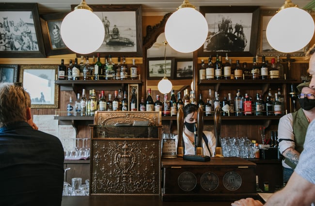 Bar area with old fashioned till at Paddy McNaughton's, Christchurch.