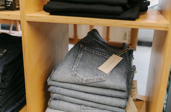 Close up of folded pair of jeans at Palm Boutique.
