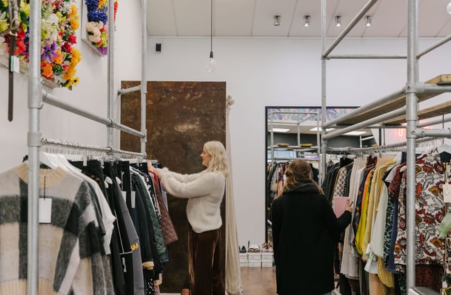 Two woman browsing at Palm Boutique.