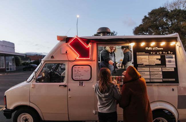 People waiting outside Patti's food truck.