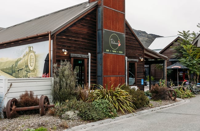 Wooden building exterior of Paulina's Bar.