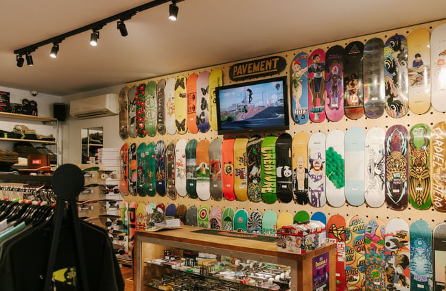 A wall covered in colourful skateboard decks at Pavement, Dunedin.