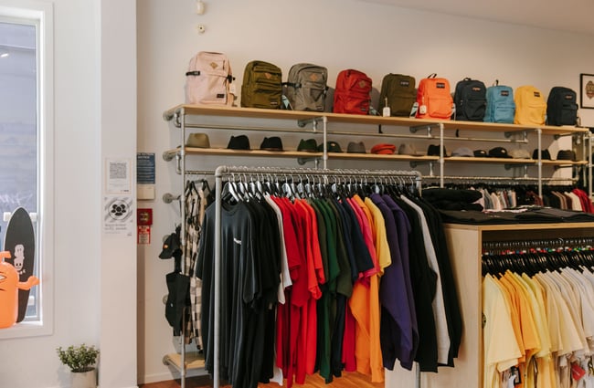 Tees, hats and bags for sale at Pavement, Dunedin.
