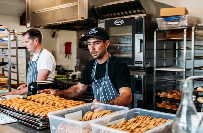 Chefs in the kitchen preparing baked goods at Pembroke Pâtisserie.