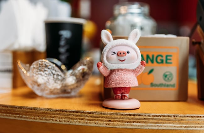 Cute little character sitting next to the tip jar at Penang Street Food.