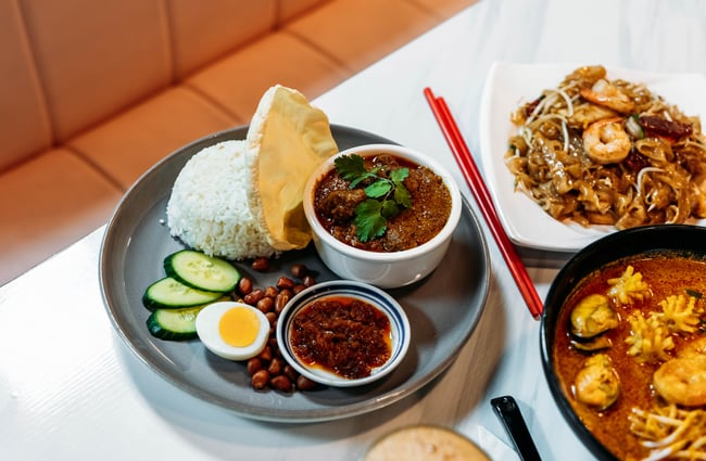 A food dish with rice and other items on the table at Penang Street Food.