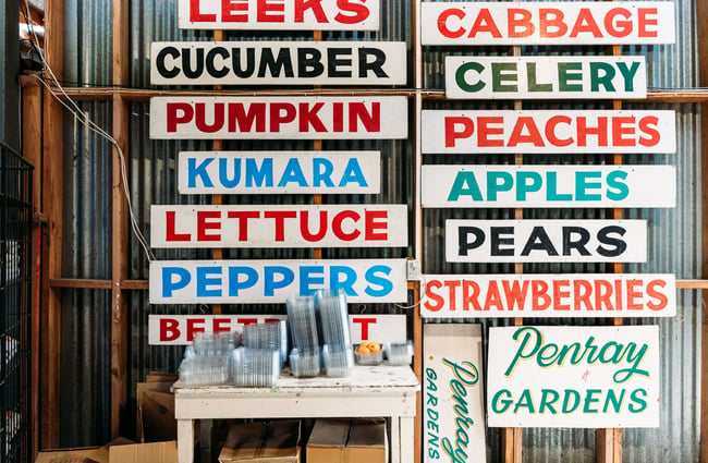A sign that says all sorts of different types of vegetables.
