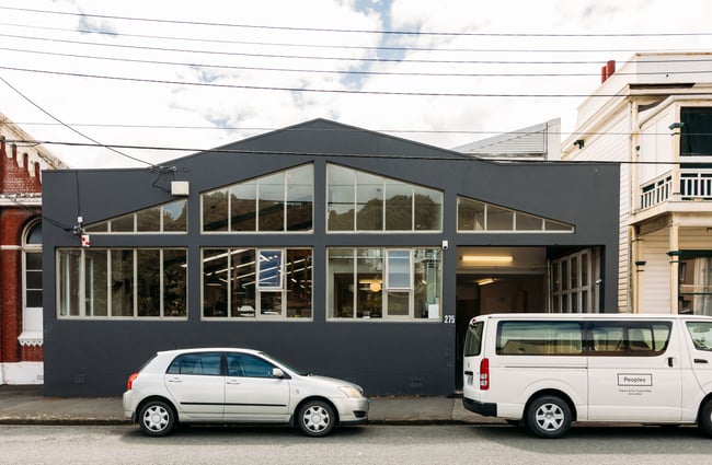 The black exterior of Peoples Coffee Roastery.