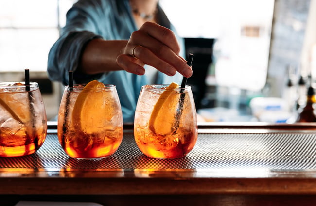 Three cocktails on a counter.