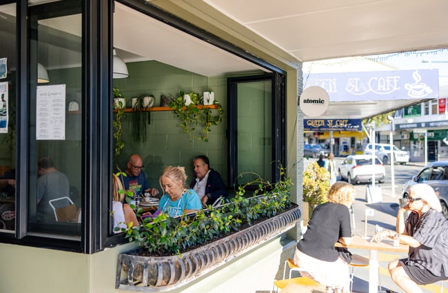 Diners sitting inside and outside at Pete & Mary's Eatery.