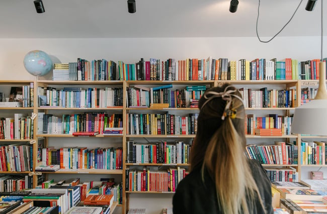 Woman looking at books at Petronella's Gallery and Bookstore, Tekapo.