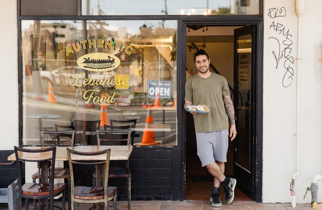 Chef standing in the doorway at Phoenician Falafel.