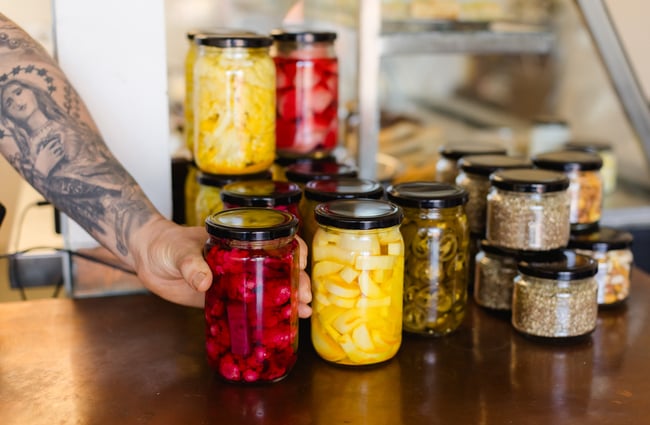 Jars of pickles on the counter at Phoenician Falafel.