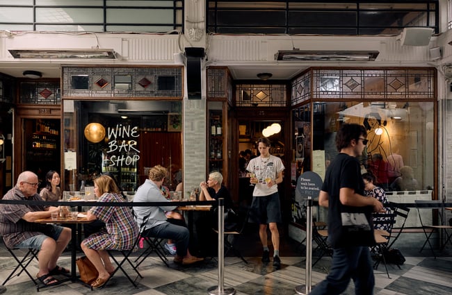 Entrance of Pici Pasta in Auckland with people dining outside in the arcade
